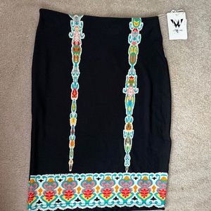 White Mark Skirt with Green , Red and Yellow Design.